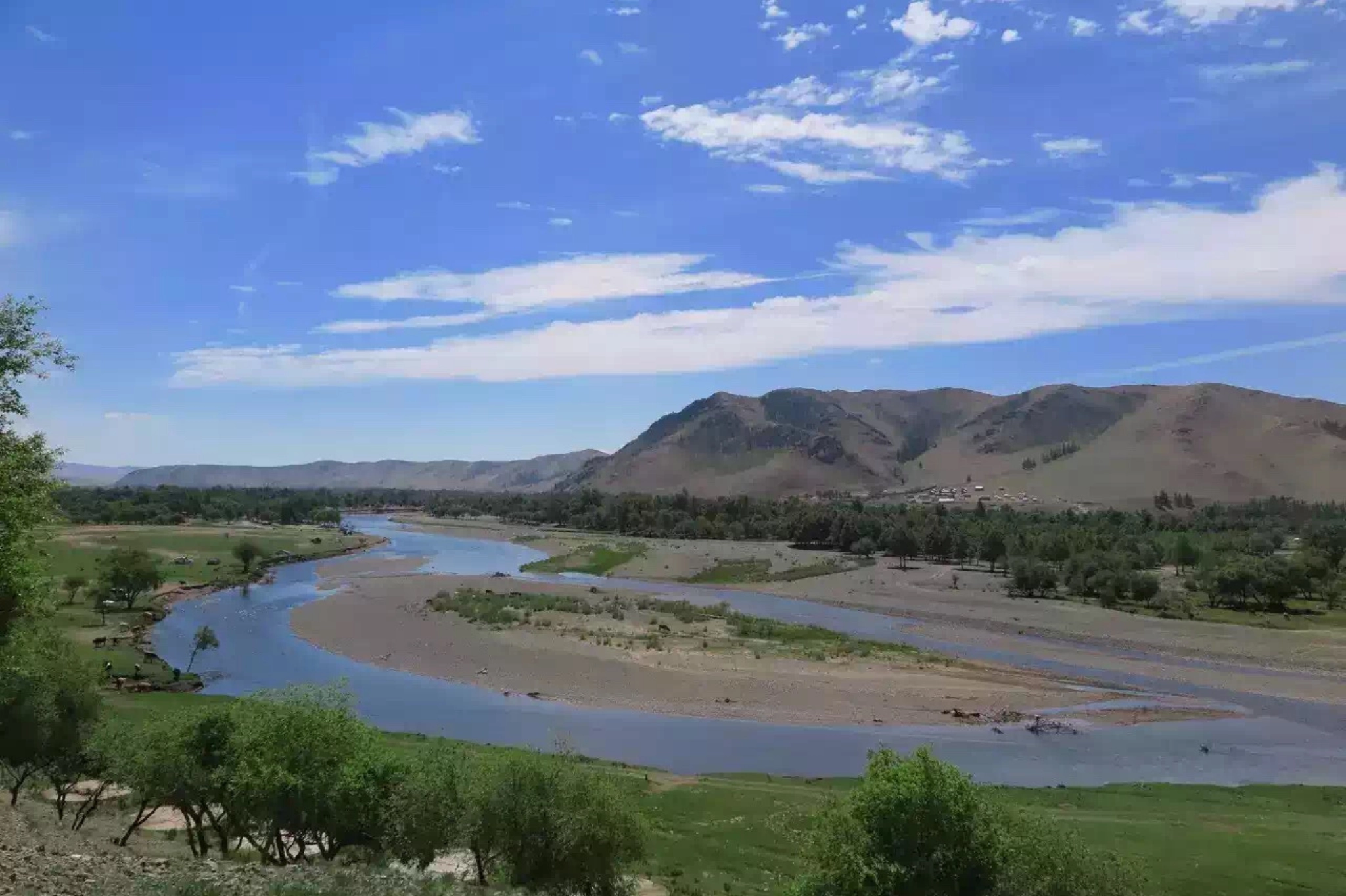 The braided river with bare brown mountains